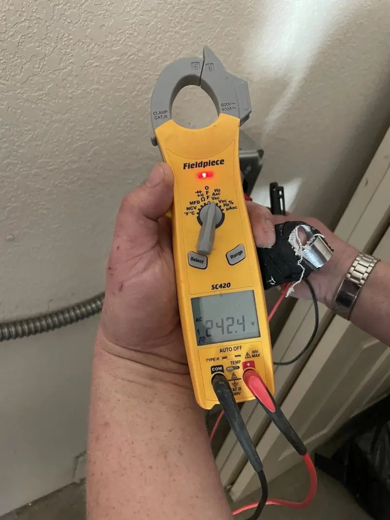 Voltage testing with clamp meter during Outlet Installation in Palos Heights